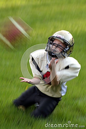 Youth Catching Football