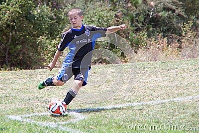 Youth Soccer Football Player Kicks the Ball