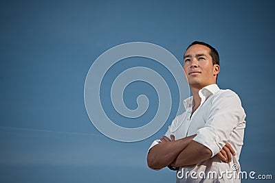 Youth standing with arms folded