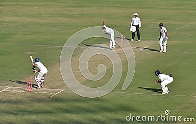 Zahir Khan s follow through in a Cricket Match