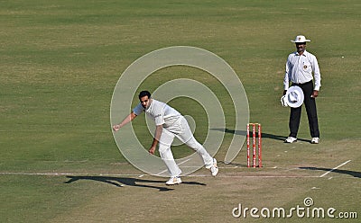 Zahir Khan s follow through in a Cricket Match