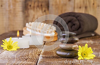Zen basalt stones and spa oil with candles