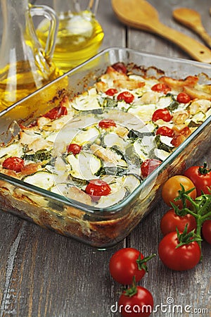 Zucchini baked i with chicken, cherry tomatoes and herbs