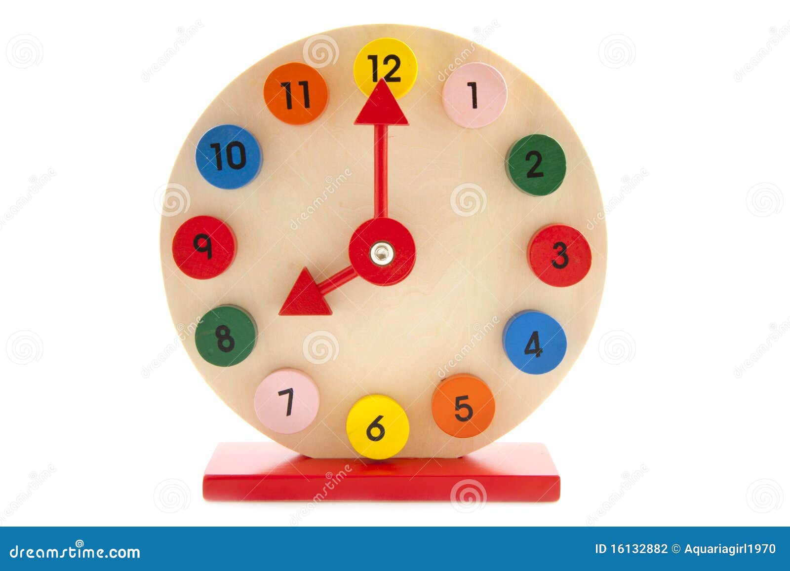 Colorful wooden clock isolated on a white background.