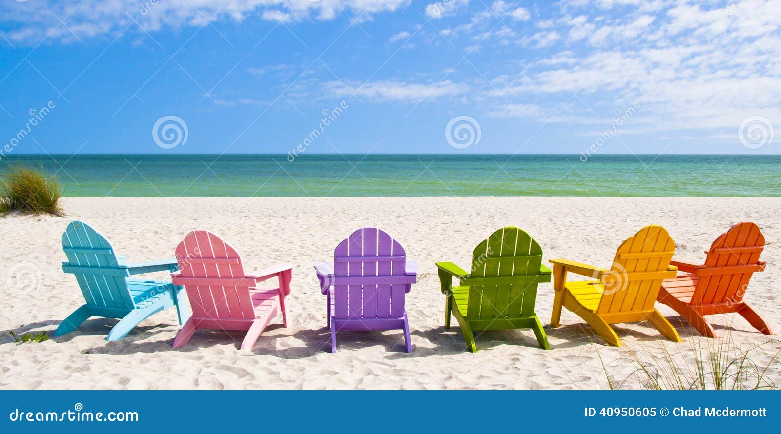 Adirondack Beach Chairs on a Sun Beach in front of a Holiday Vacation 