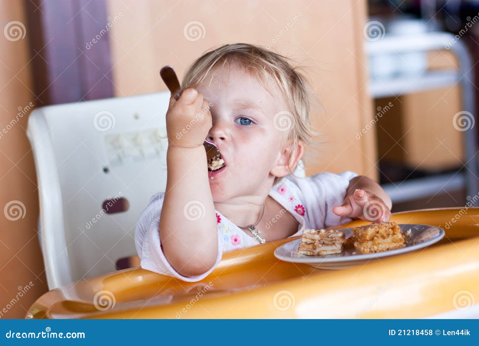 Adorable Baby Eating Cake In A Chair Royalty Free Stock ...