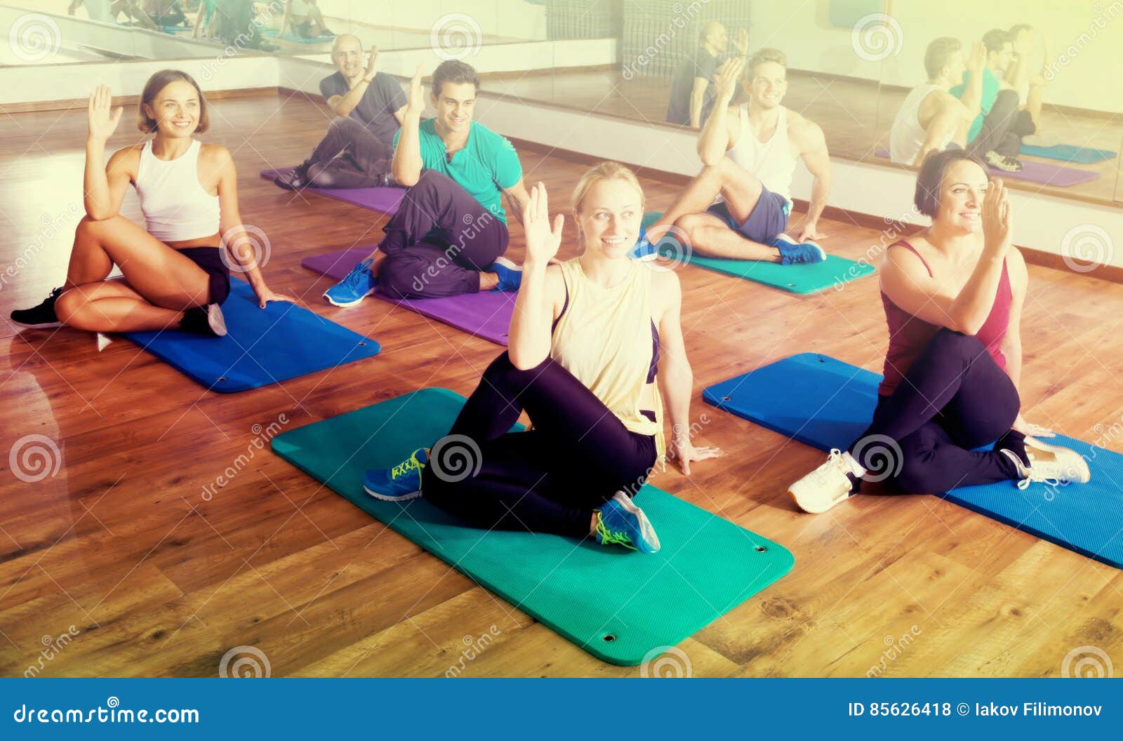Adults Having Yoga Class In Sport Club Stock Photo Image Of Happy