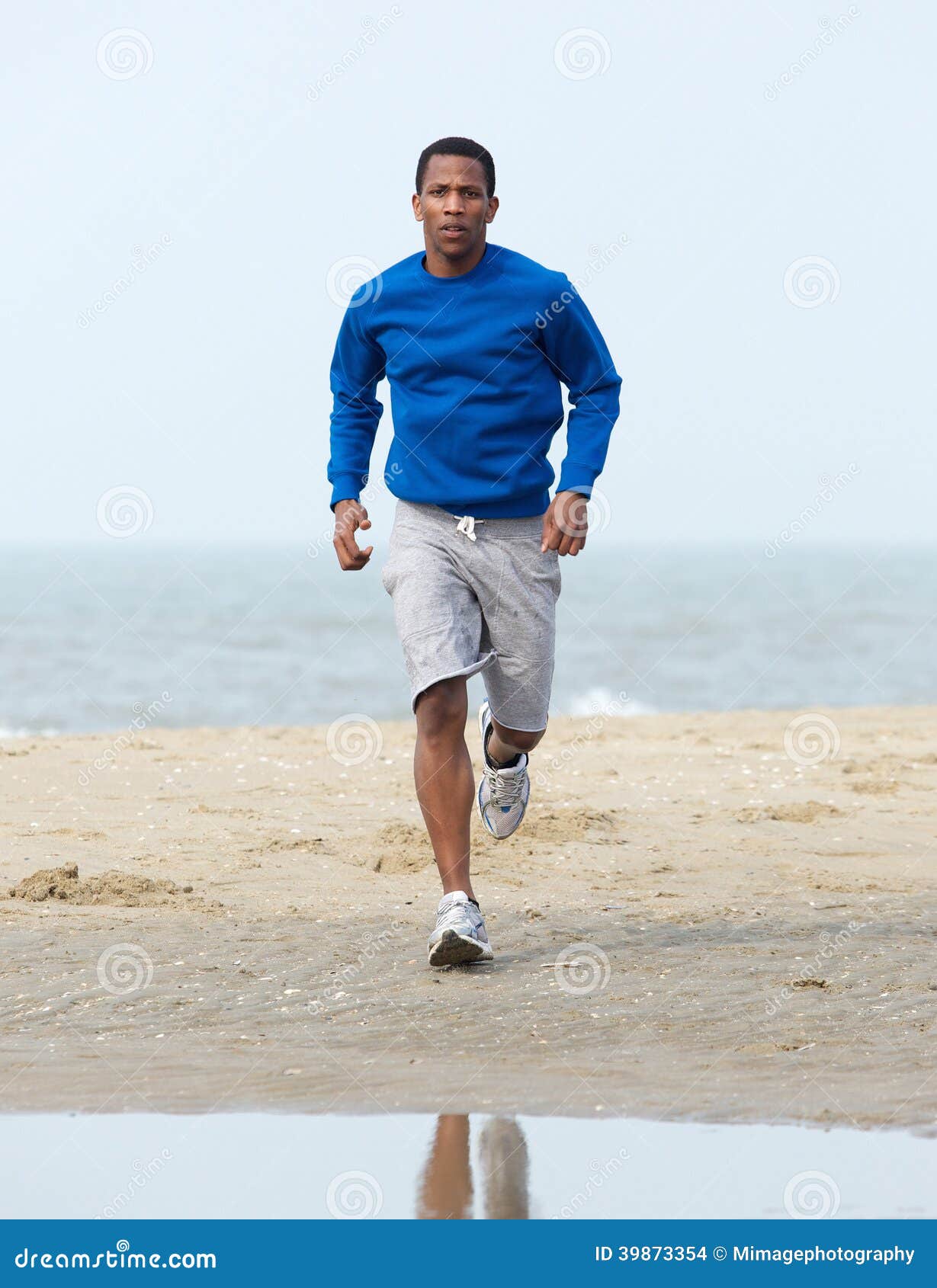 Young Man Jogging Beach