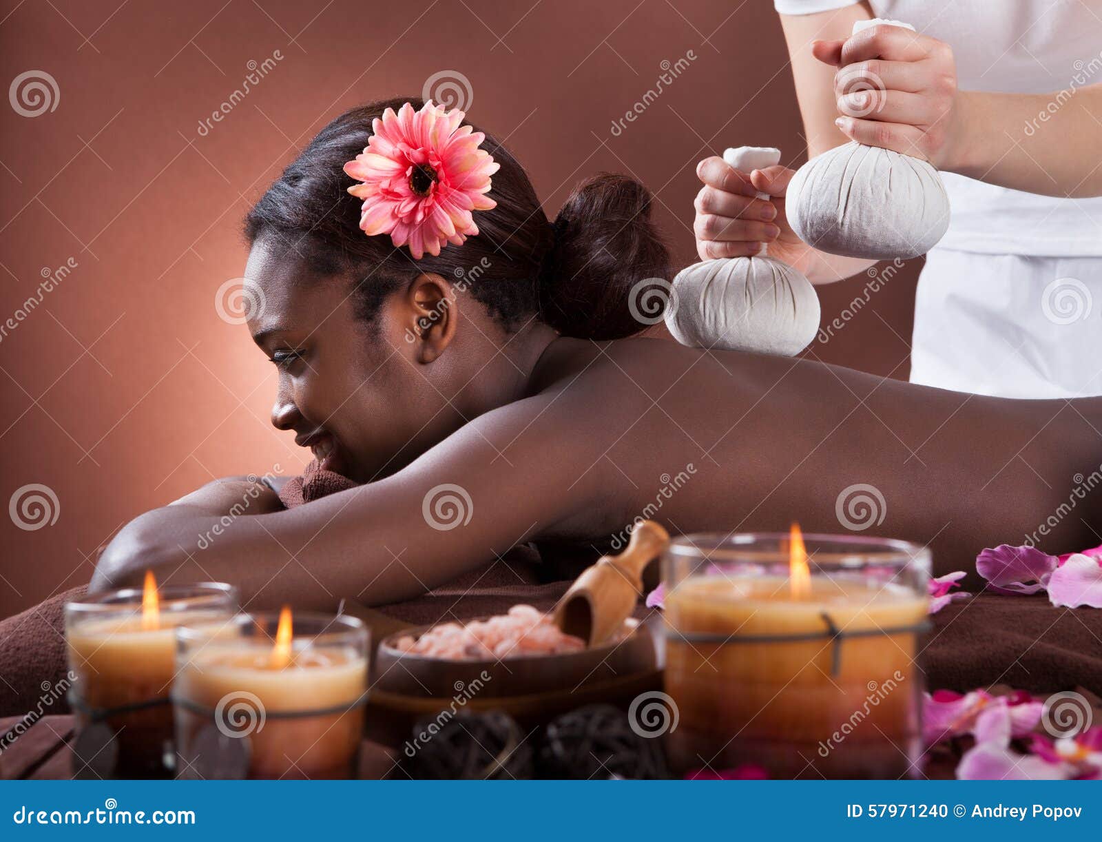 African American Woman Enjoying Herbal Massage At Spa Salon