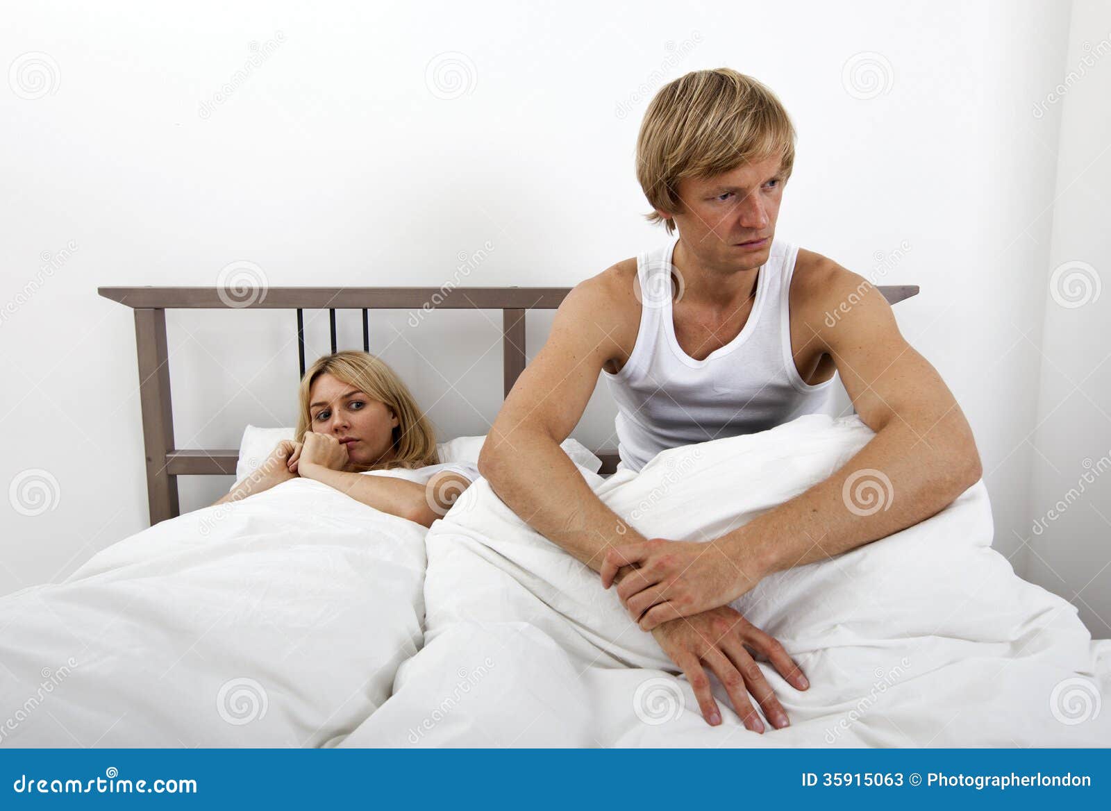 angry-man-sitting-bed-woman-house-men-women-35915063.jpg