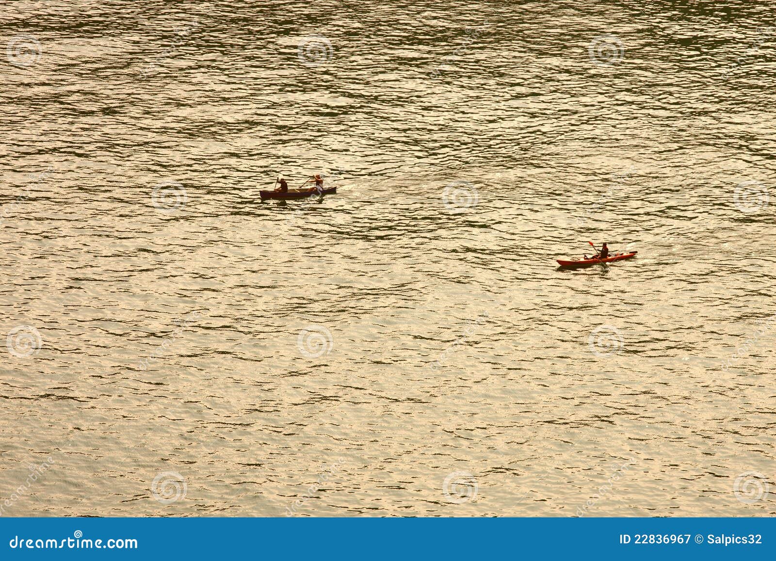 Royalty Free Stock Photography: Anonymous people rowing a boat