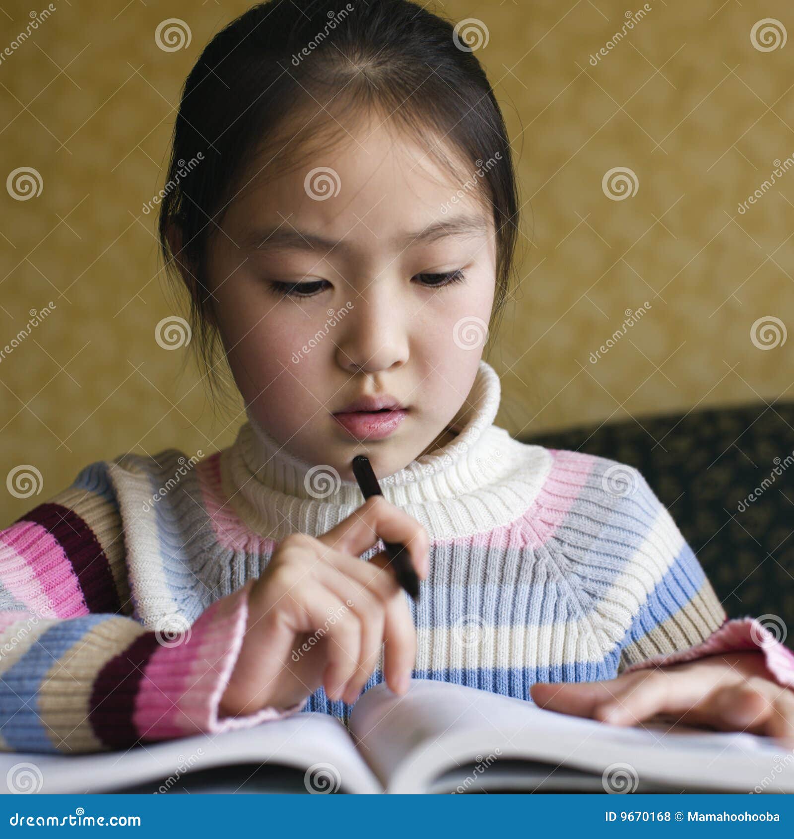asian child doing homework