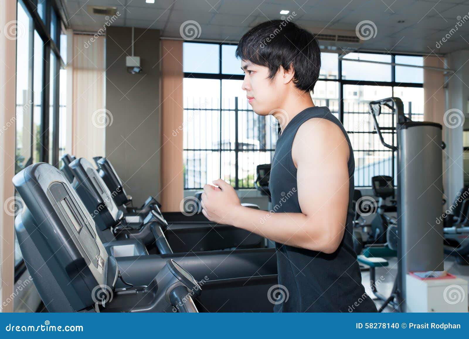 Asian Man Jogging On A Treadmill. Healthy Lifestyle Stock Photo ...