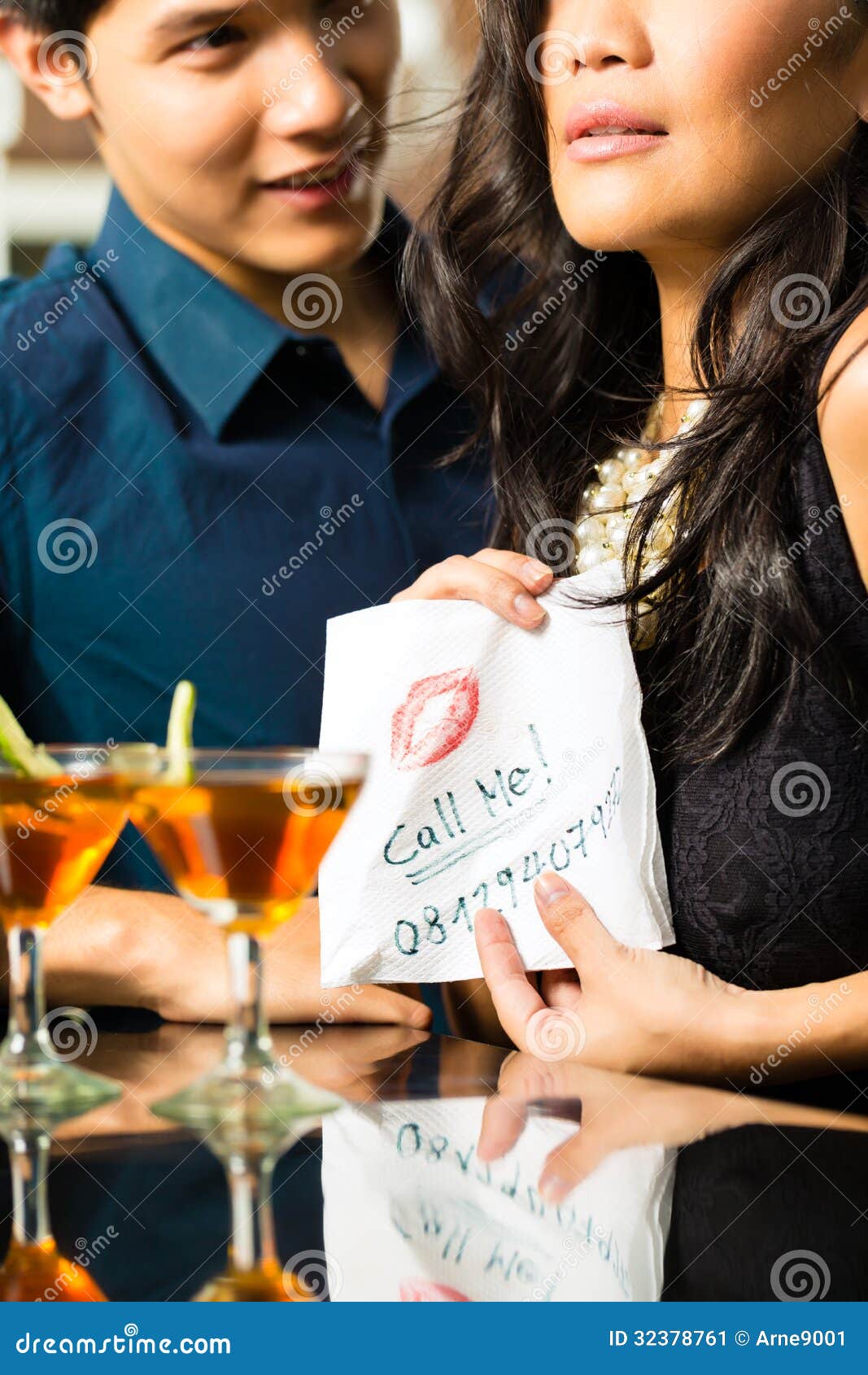 Asian Woman Seduces The Man In Restaurant Stock Image