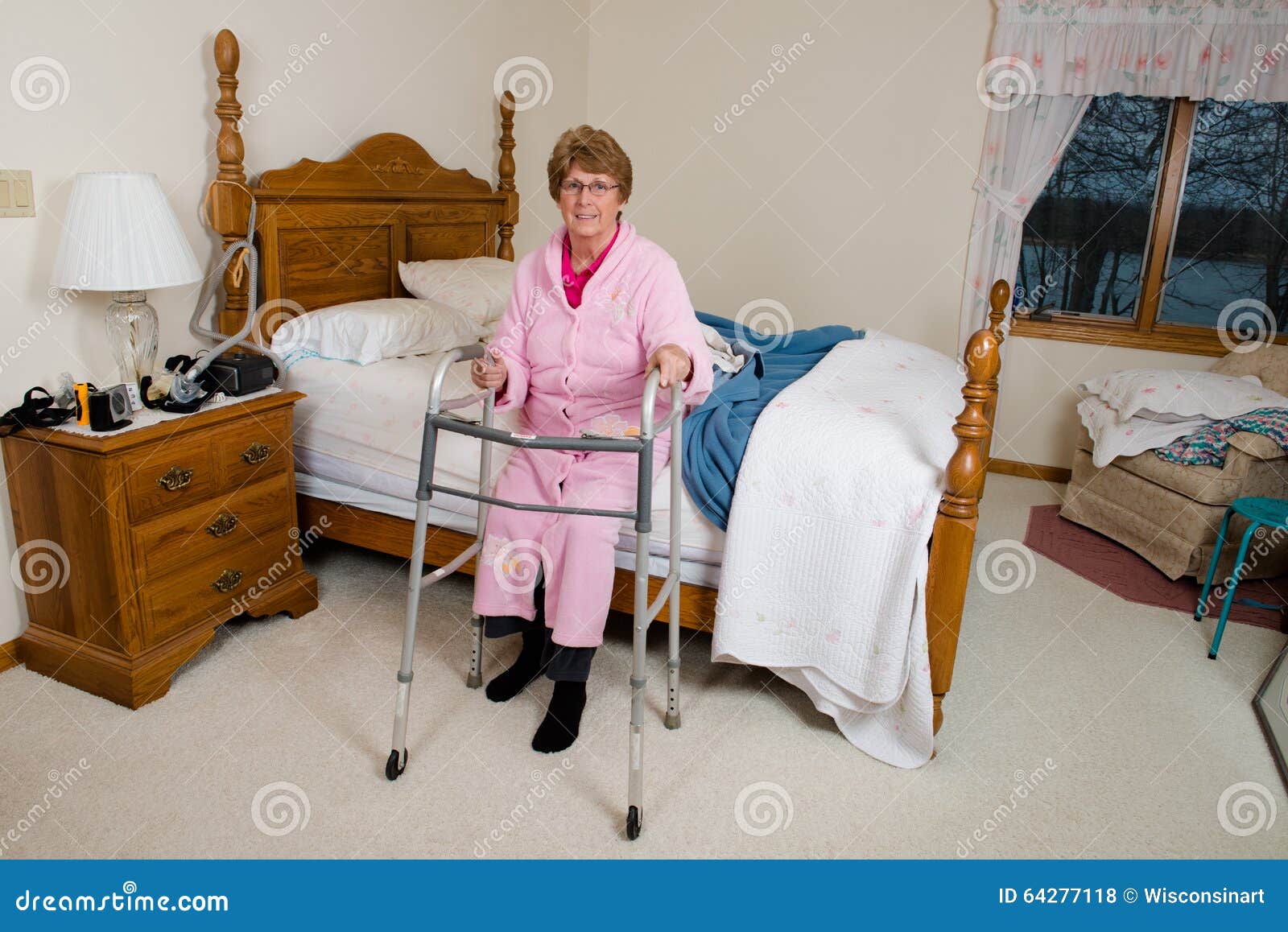 assisted-living-nursing-home-elderly-woman-old-senior-sits-her-bed-medical-walker-aid-female-happy-has-64277118.jpg