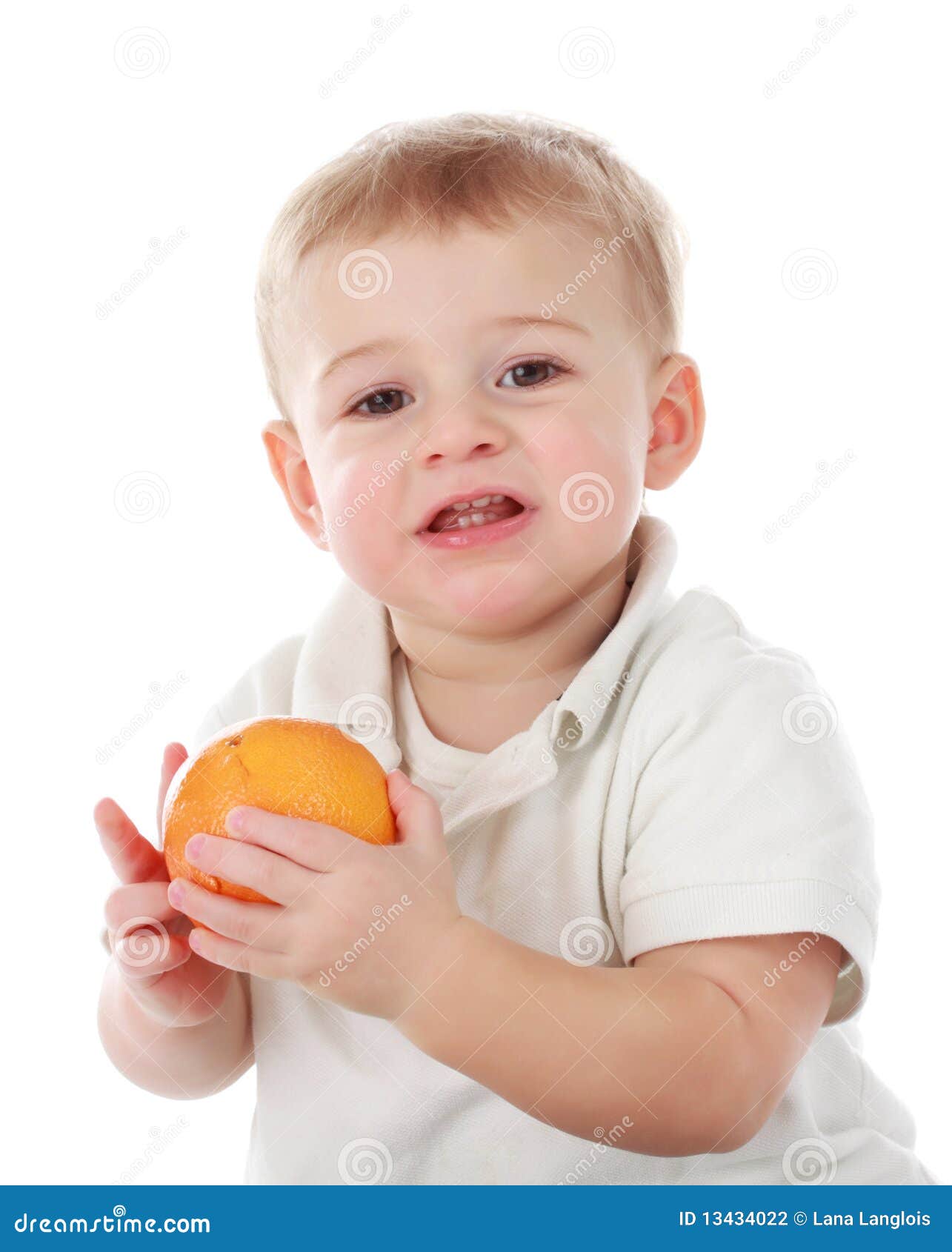 Baby Boy Holding An Orange Stock Photography - Image: 13434022