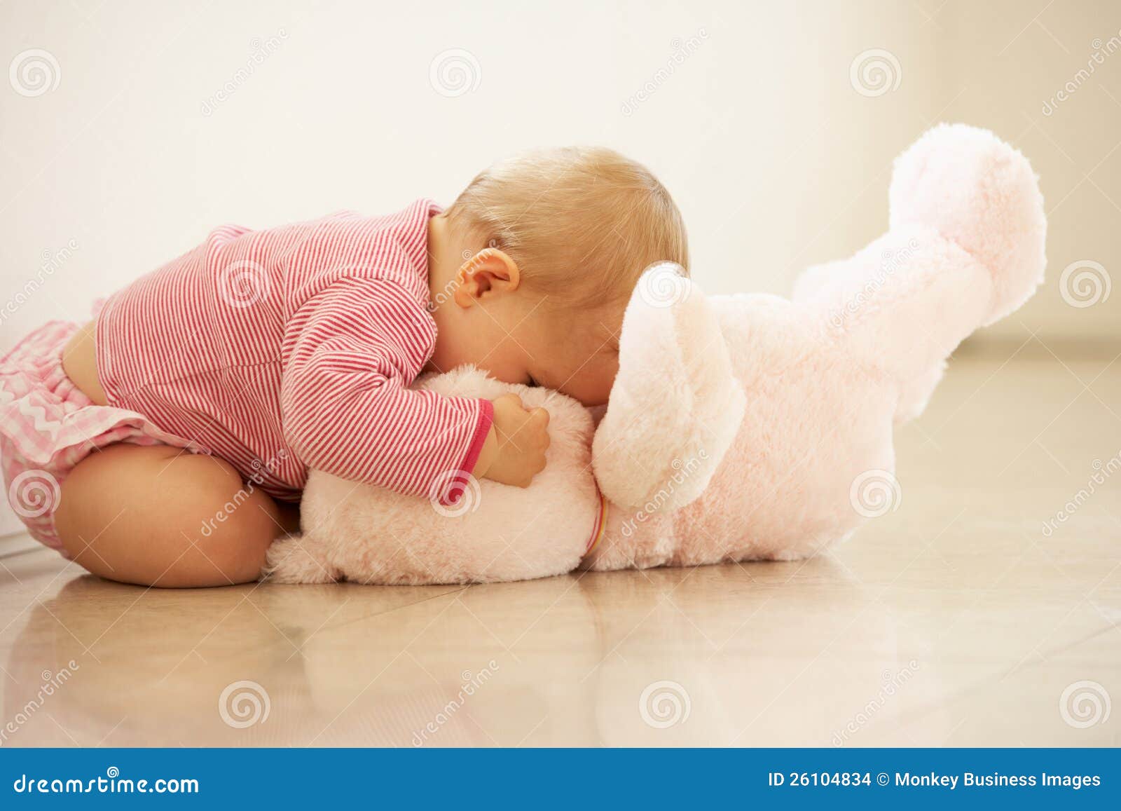 Baby Girl Cuddling Pink Teddy Bear At Home Stock Images - Image: 26104834