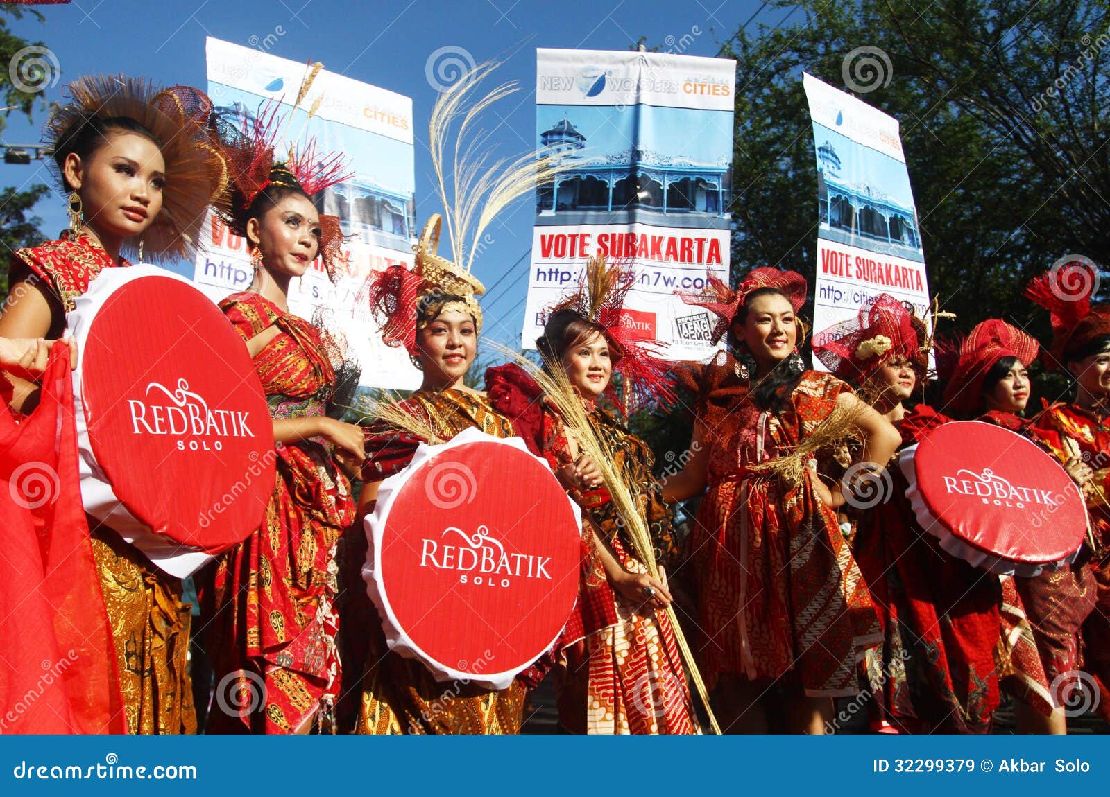 Model presenting batik creation of red batik in solo, central java Model presenting batik creation of red batik in solo, central java