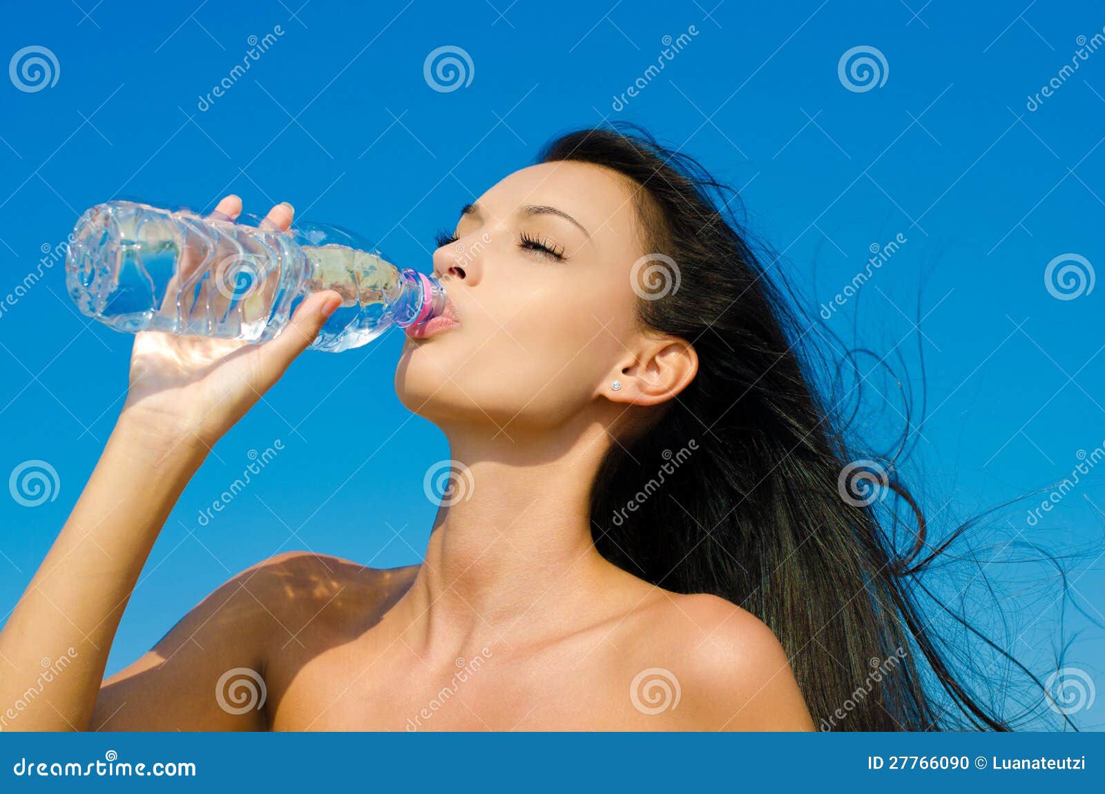 Beautiful Girl Drinking From A Bottle Of Stock