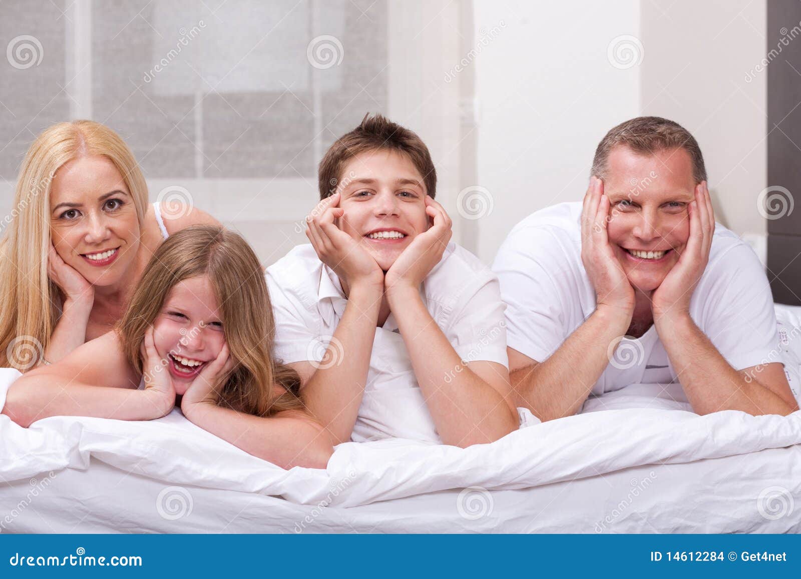 Beautiful Family Lying On Bed Beautiful Family Lying On Bed Smiling Stock Images Image
