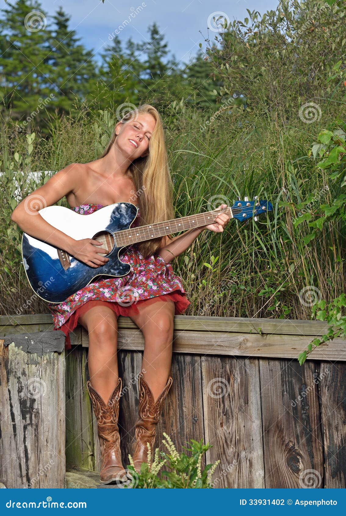 Beautiful Female Guitar Player Outdoors Stock Phot photo pic