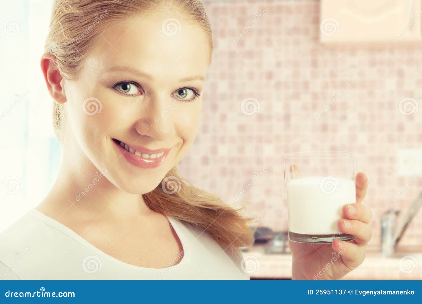  Free Stock Photography: Beautiful healthy girl with a glass of milk