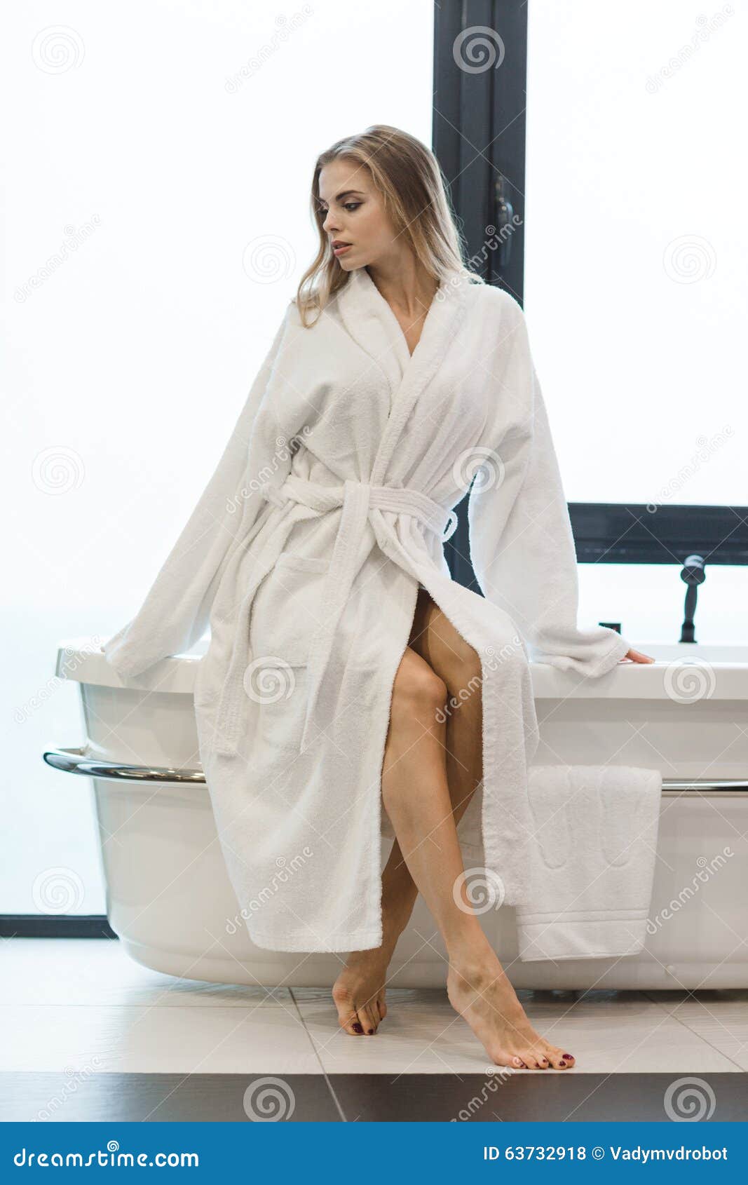 Beautiful Sensual Barefooted Female In White Bathrobe Sitting On Bathtub Stock Photo Image Of