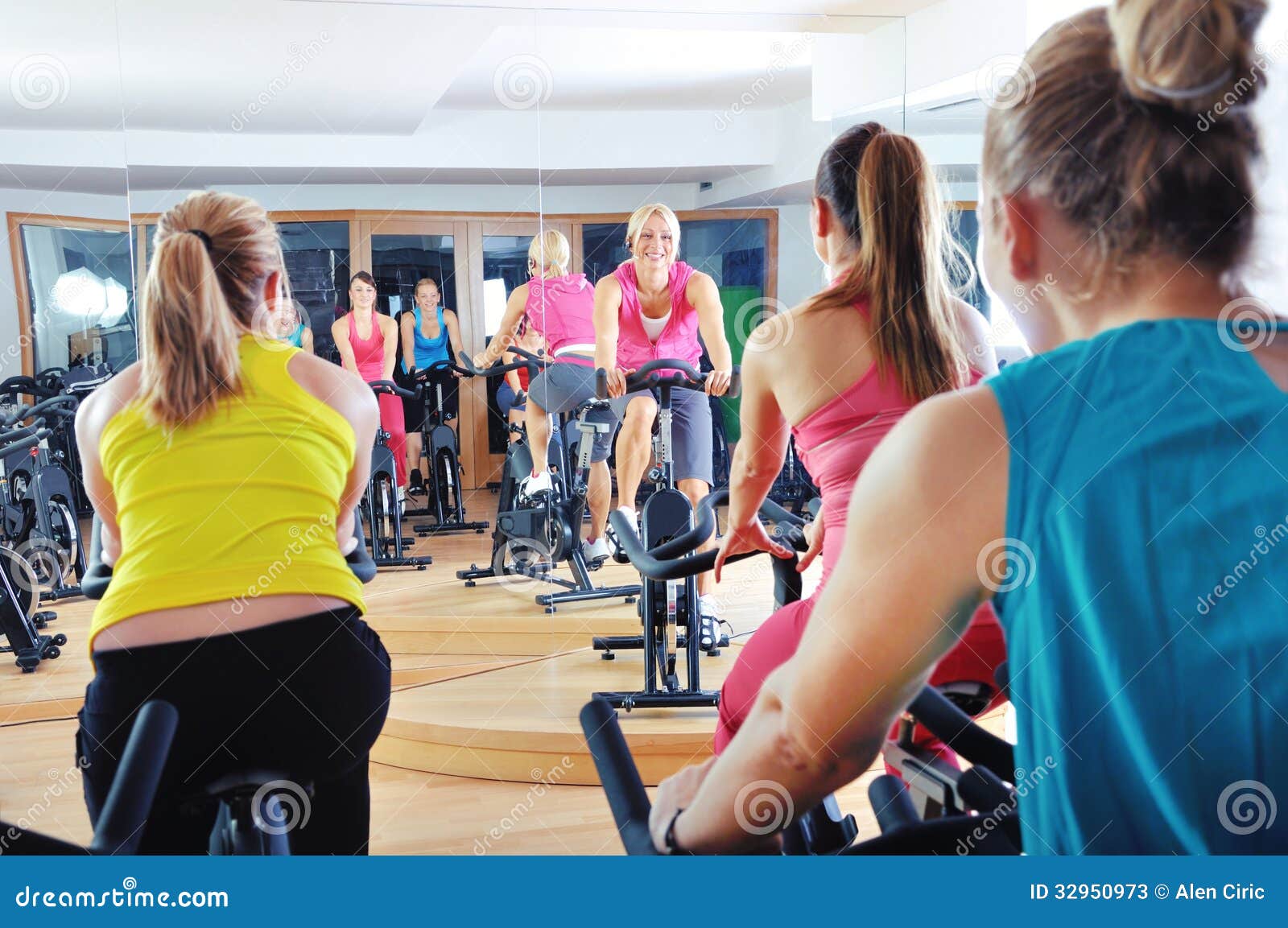 Beautiful Woman Doing Exercise In A Spinning Class Stock