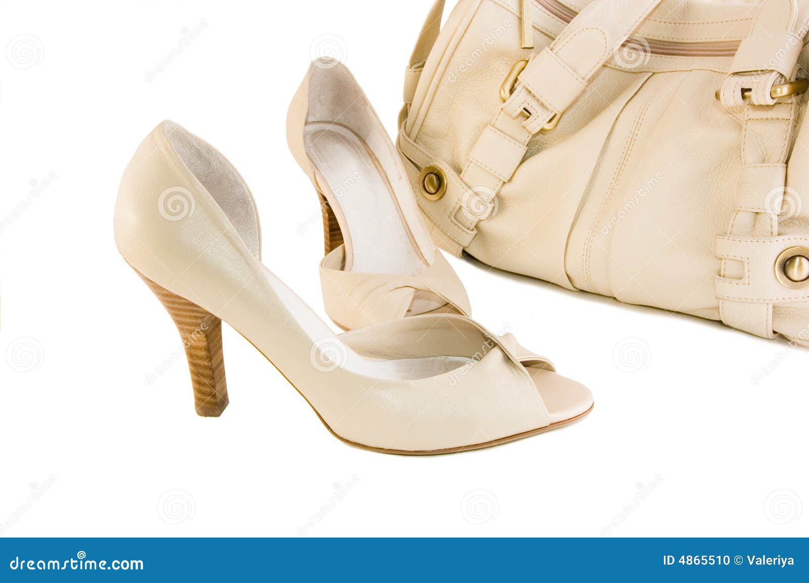 Beige shoes and handbag isolated on white