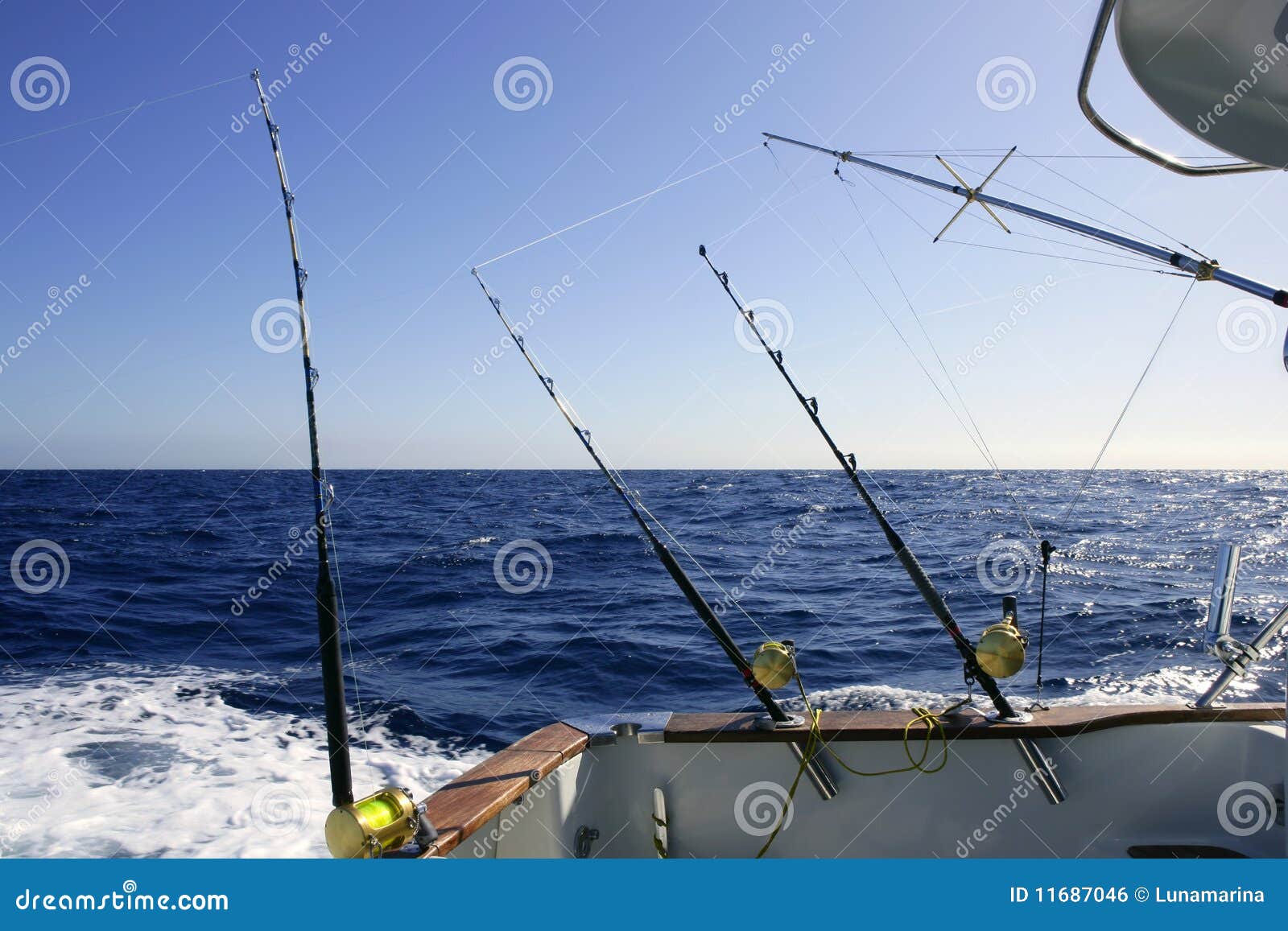 Big game boat fishing in deep sea on boat.