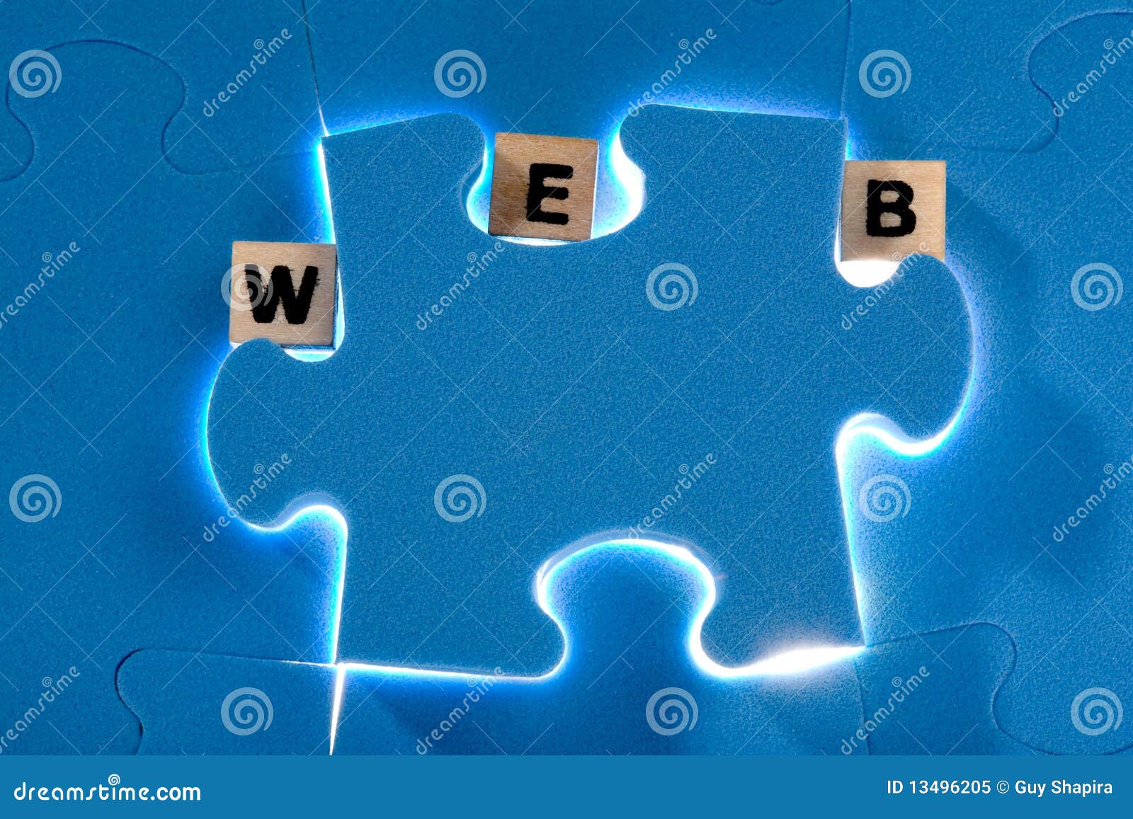 Royalty Free Stock Photo: Blue puzzle with wood letter