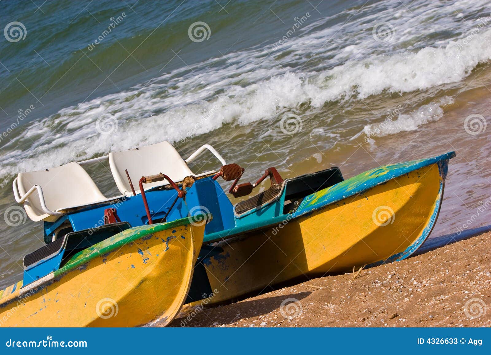 Leisure series: promenade catamaran on the beach of stormy sea.