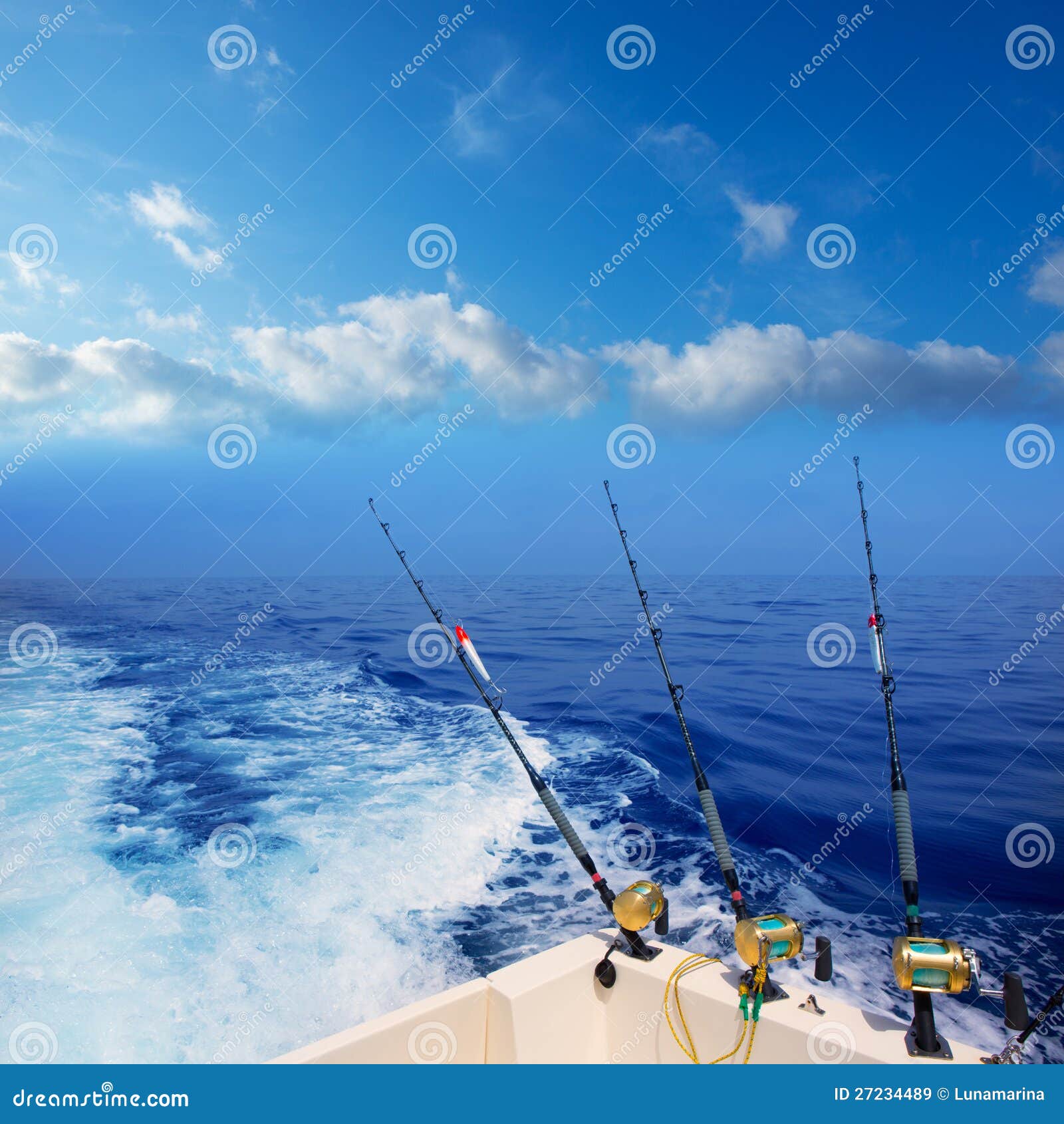 Boat fishing trolling in deep blue ocean offshore in Mediterranean sea 