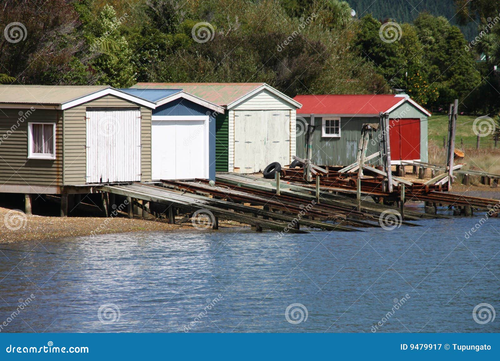 Colorful wooden boat garages at Queen Charlotte Sound in Marlborough 