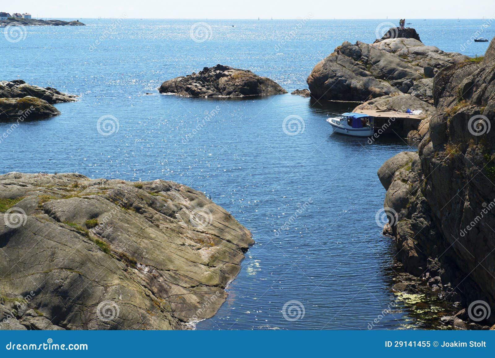 Boat at jetty by the sea in Swedish west coast archipelago.