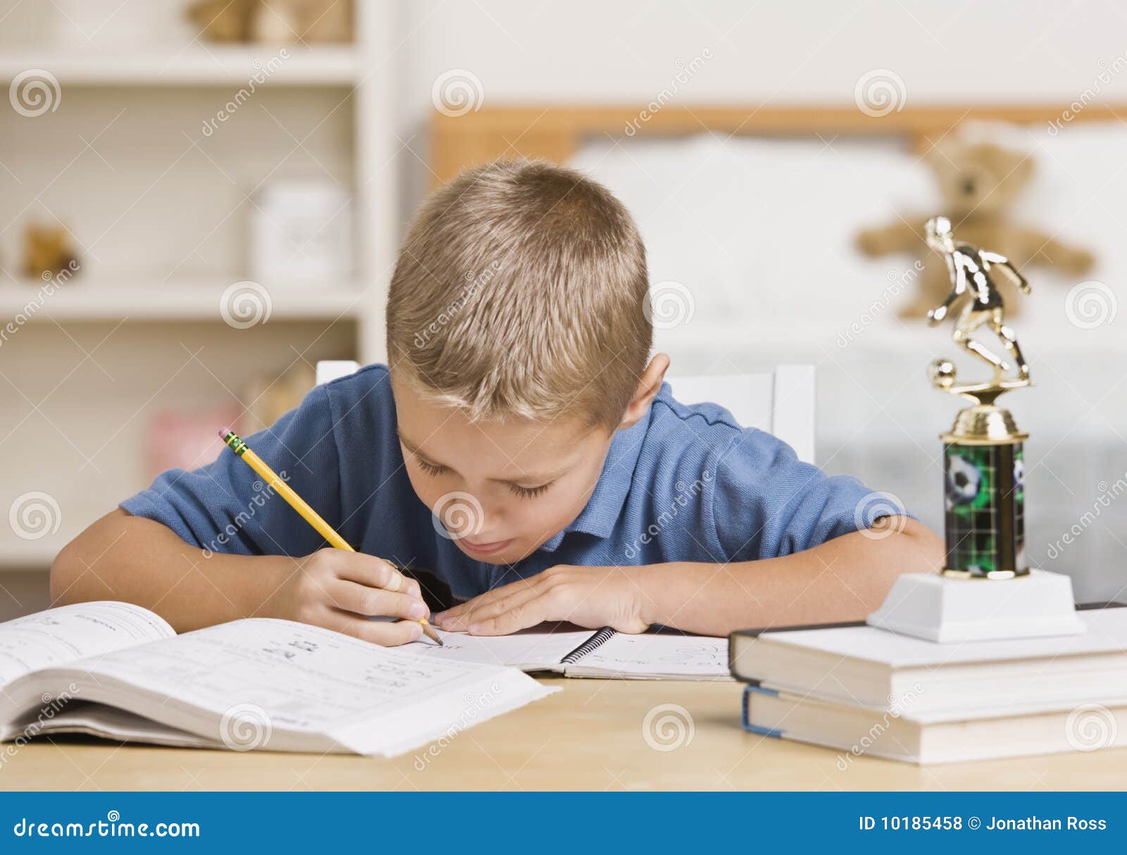 boy doing homework image