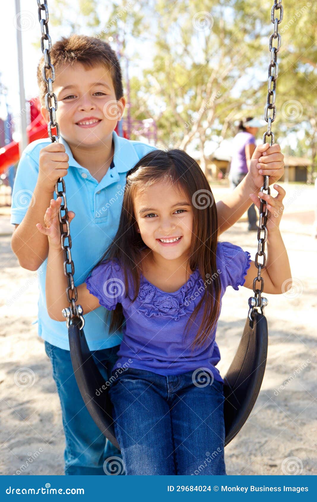 boy-girl-playing-swing-park-29684024.jpg