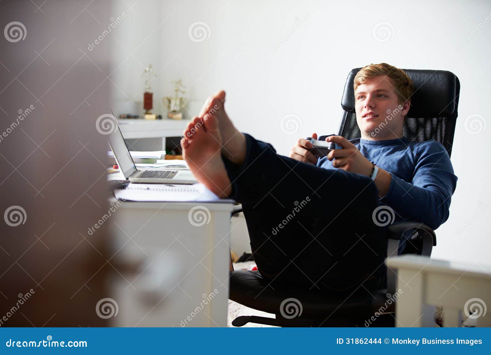 Boy Playing Video Game In Bedroom Stock Images - Image: 31862444