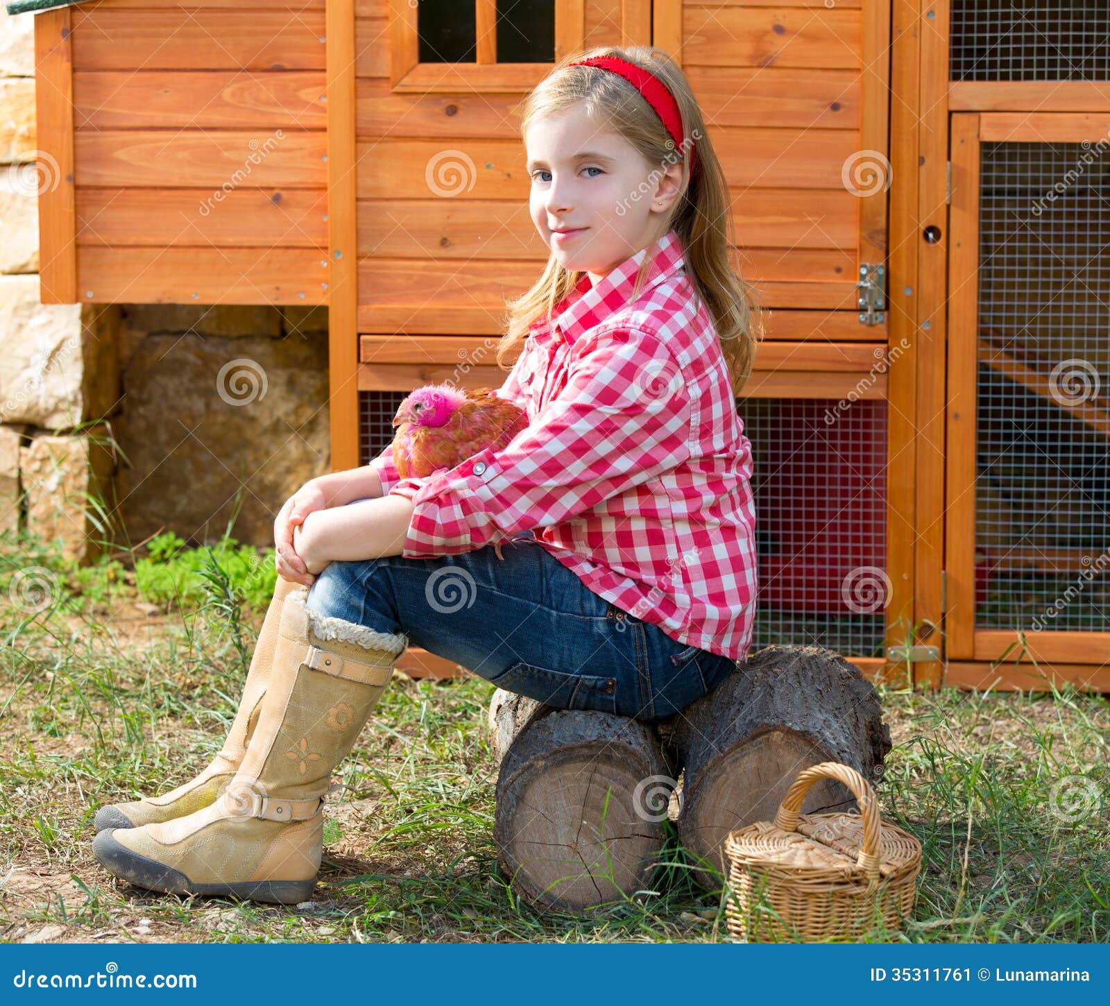  girl rancher blond farmer playing with chicks in chicken tractor coop