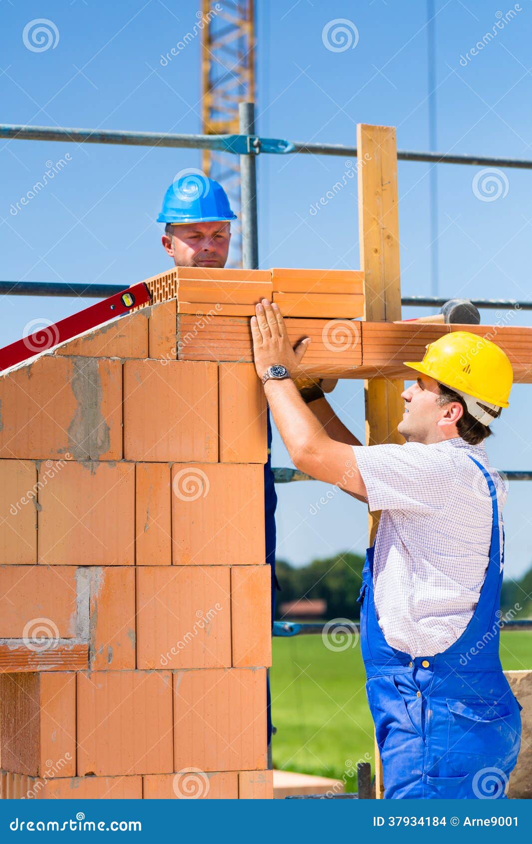 Bricklayer Or Builders On Construction Site Working Stock Images