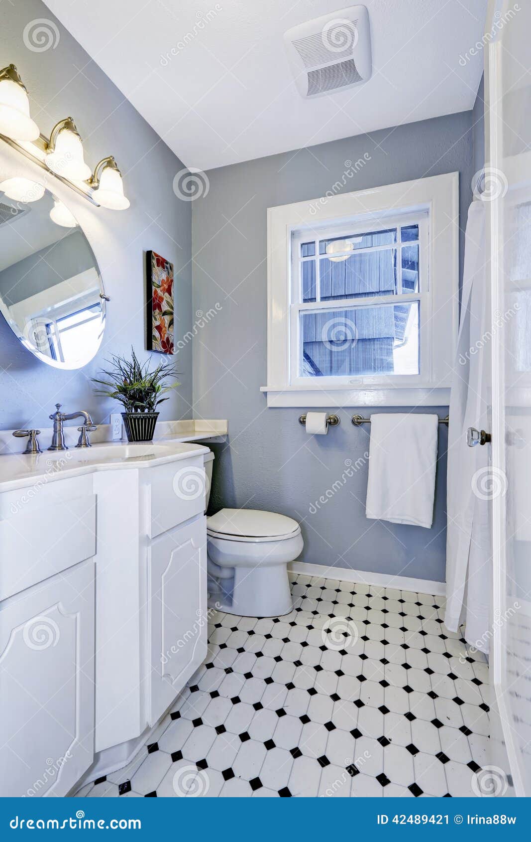 Modern blue bathroom interior with equipment and window ...