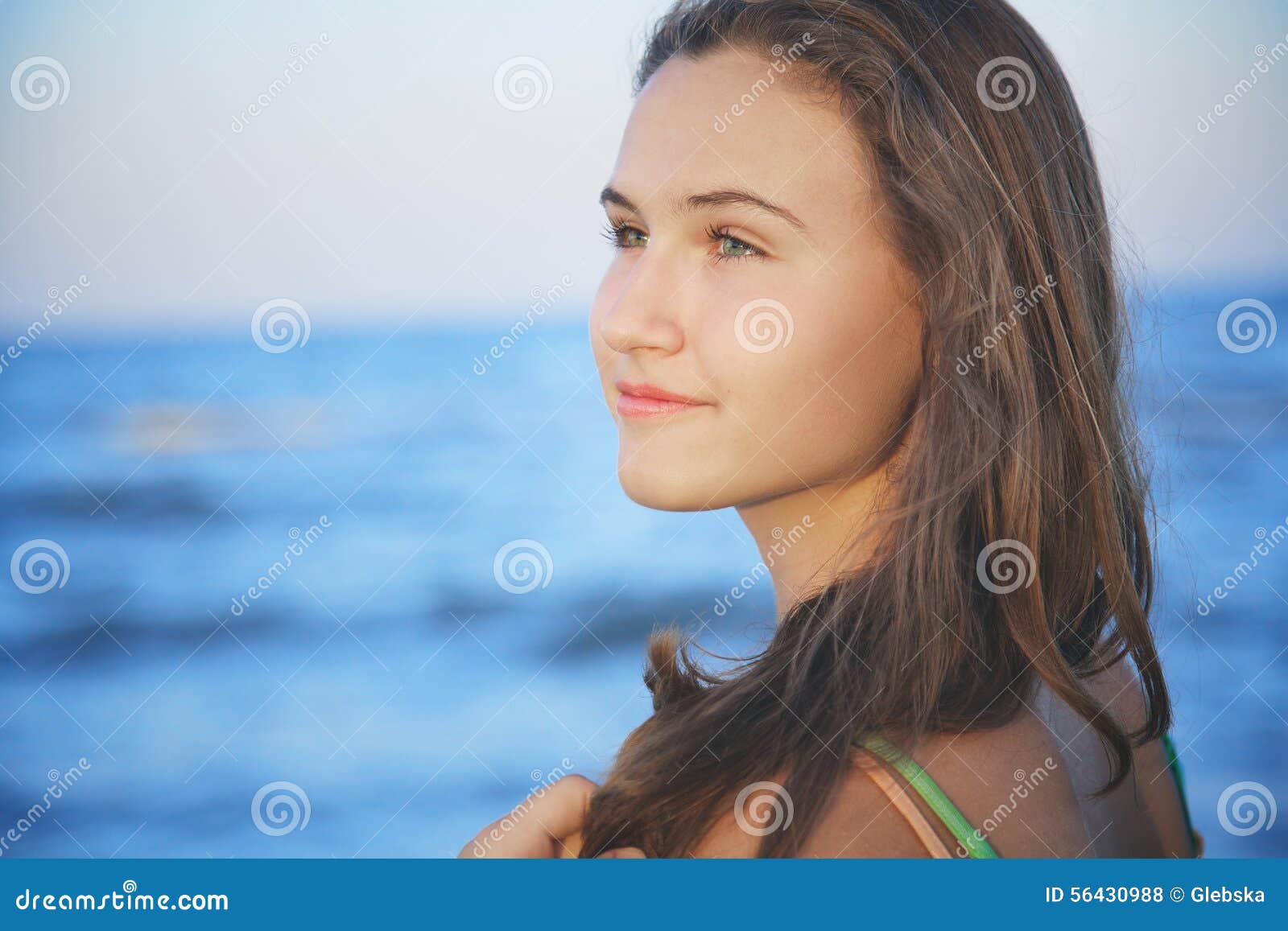 <b>...</b> teenager girl corrects long hair on beach at summer <b>evening wind</b>. - brown-haired-young-girl-beach-summer-evening-romantic-teenager-corrects-long-hair-wind-56430988