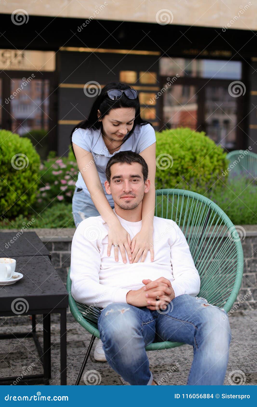 Brunette Wife Hugging Husband Sitting In Chair At Street Cafe Outside Stock Photo Image Of 57240 Hot Sex Picture