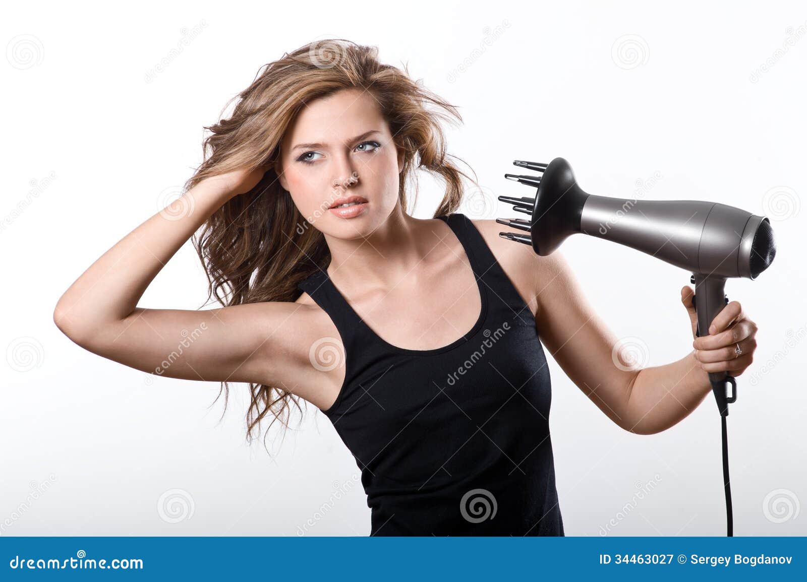 Brunette Woman Blow Drying Long Hair Royalty Free Stock