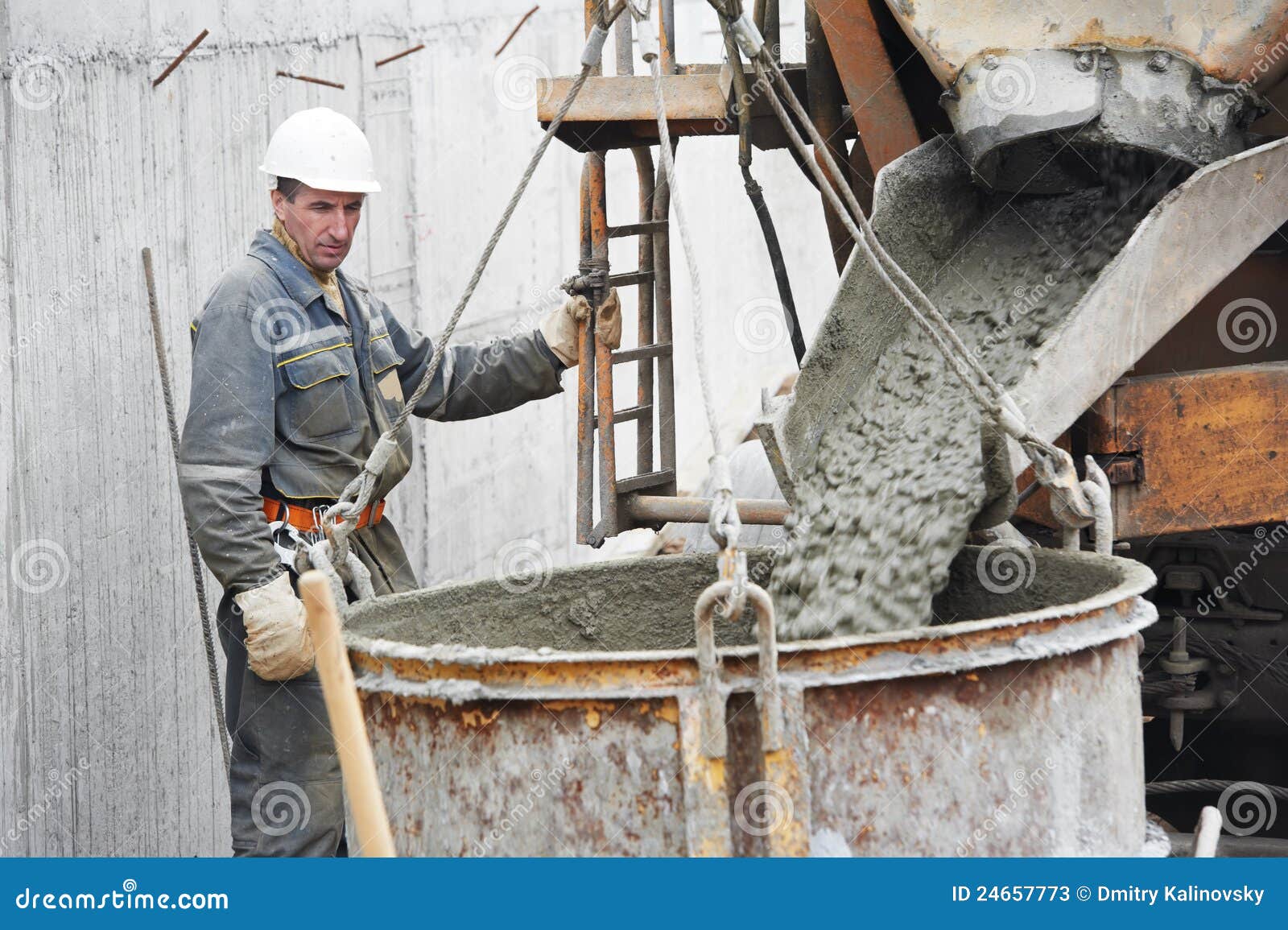 Builder Worker Pouring Concrete Into Barrel Stock Photos - Image: 24657773