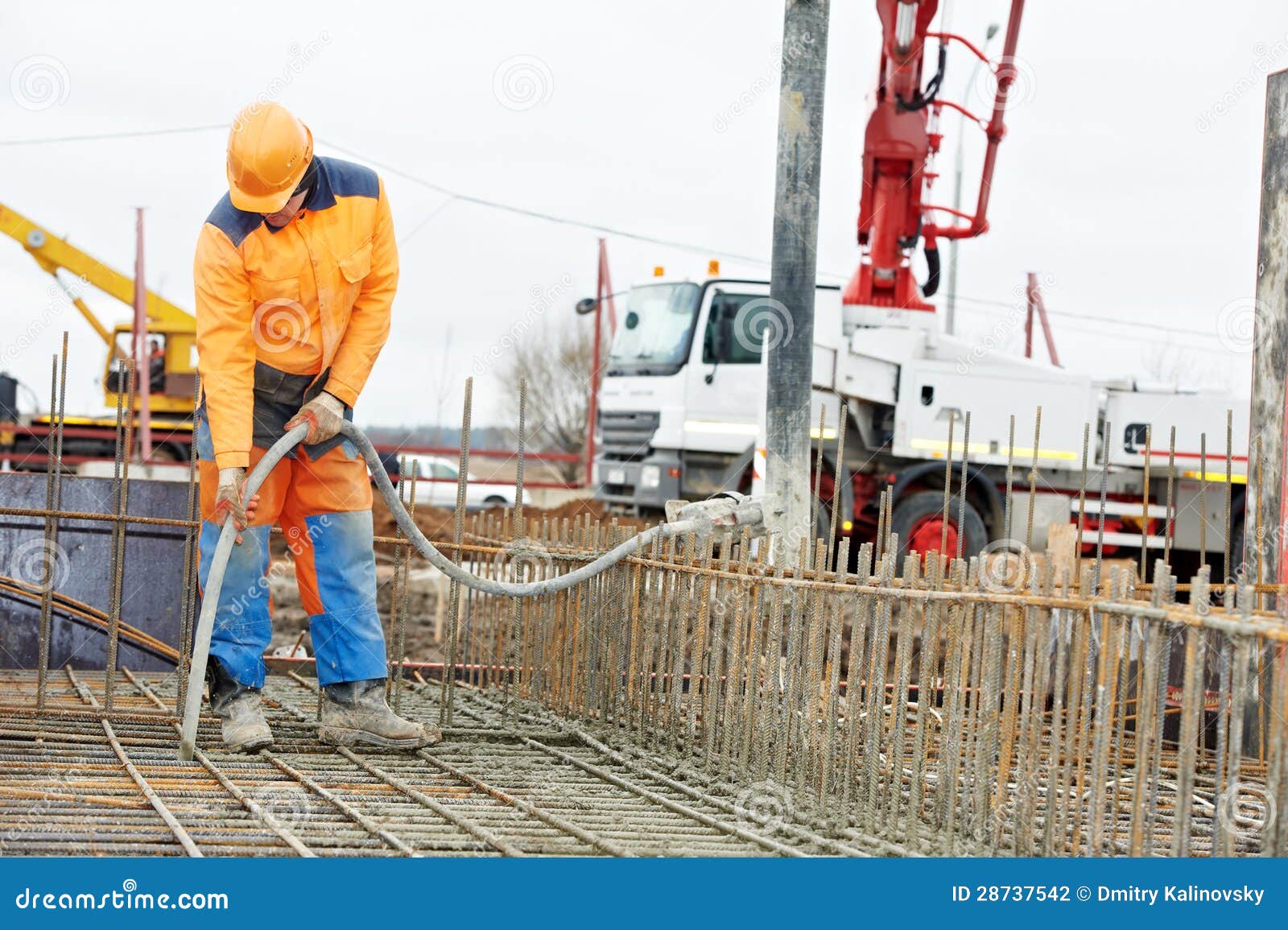 Builder Worker Vibrating Concrete In Form Stock Photography - Image