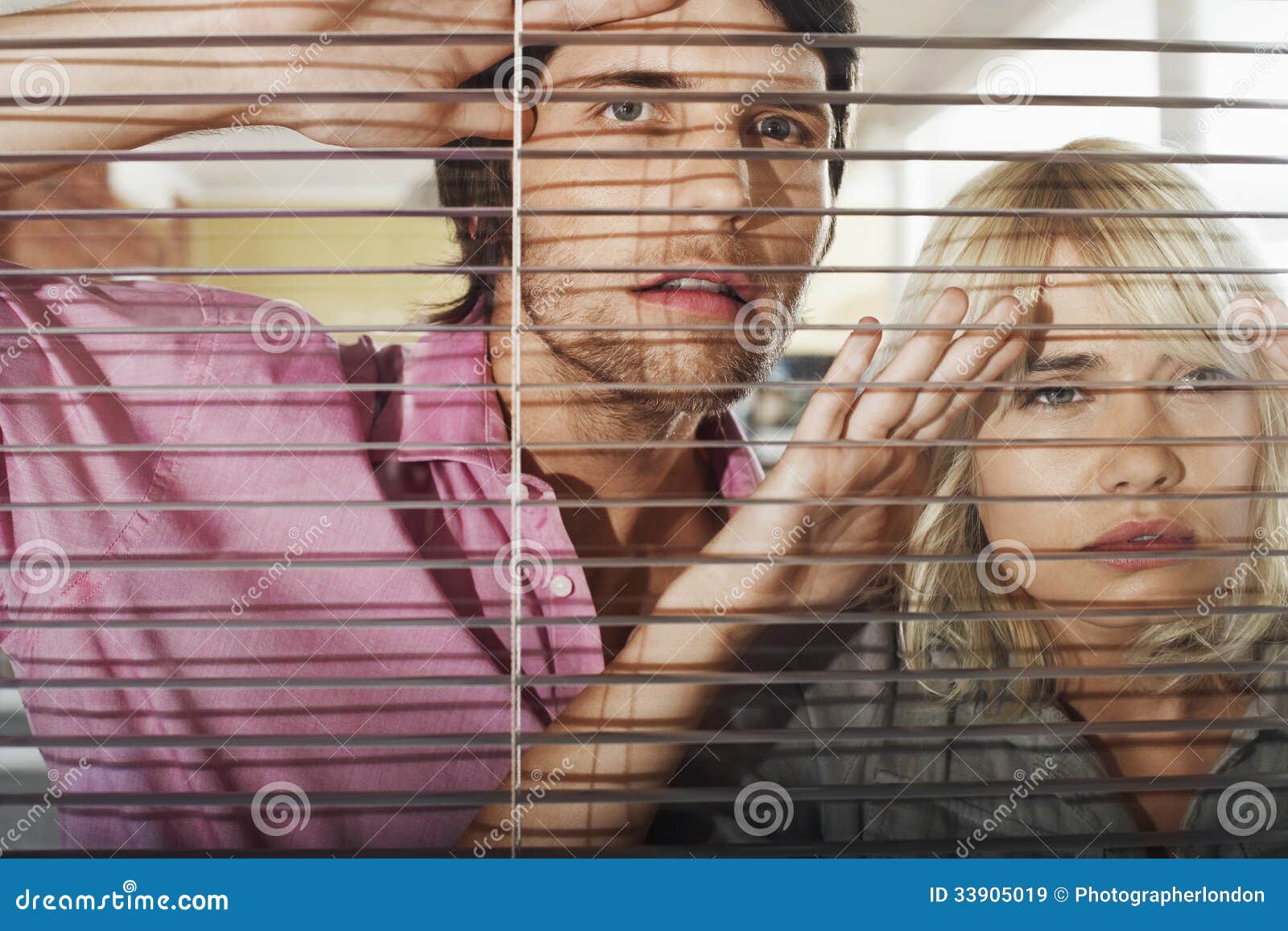 Business People Looking Through Blinds Royalty Free Stock