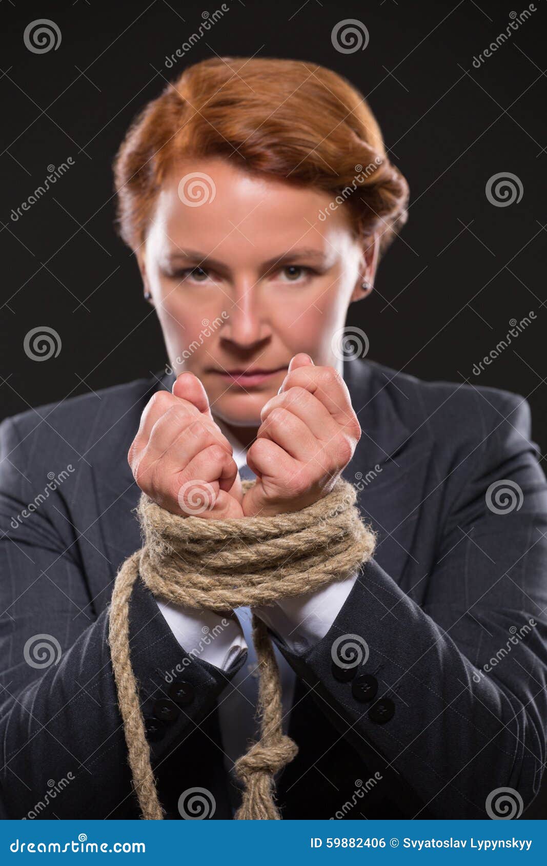 Businesswoman S Hands Tied Up With Rope Stock Photo Image