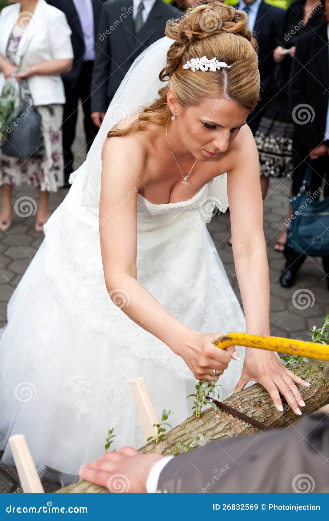  Bride Sawing Low With Saw Royalty Free Stock Images - Image: 26832569