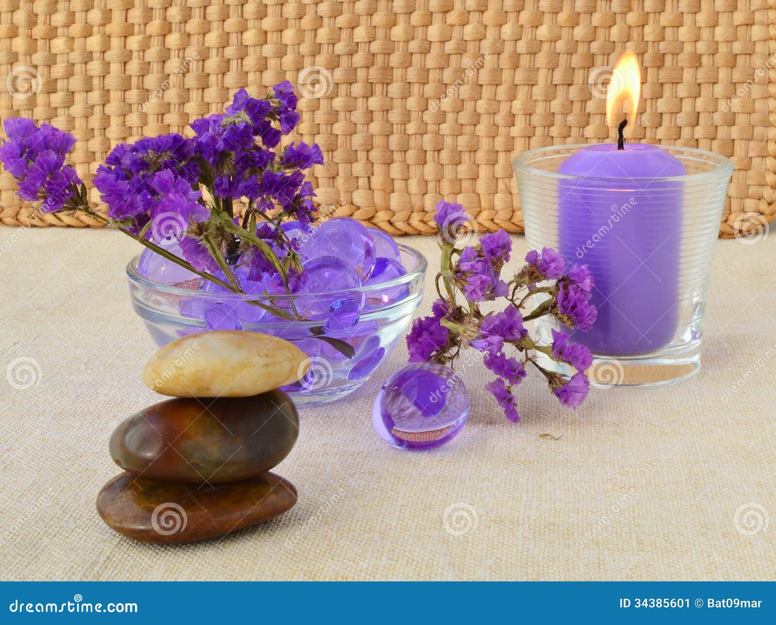 Candle And Purple Flowers Stock Image - Image: 34385601